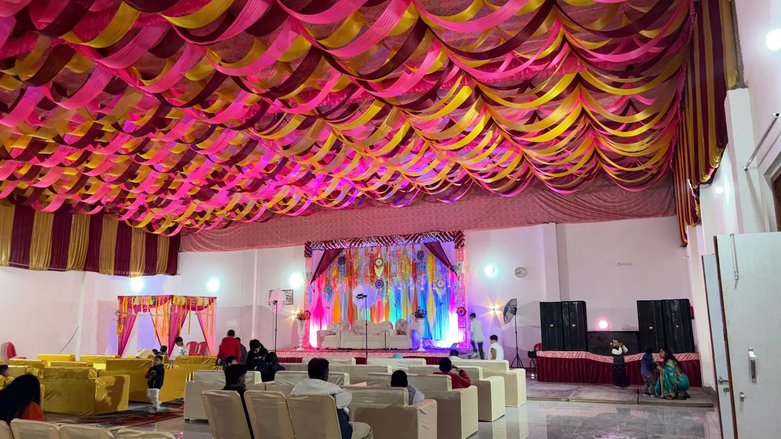 Banquet hall interior with draping and seating at Siya Mandapam